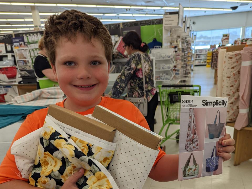 Sam with sewing supplies.