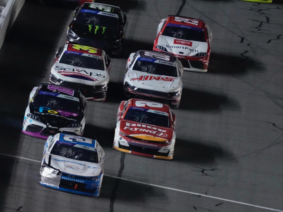 Austin Hill gets to the checkered flag first to win Stage 2 of the United Rentals 300 on Monday night at Daytona International Speedway.