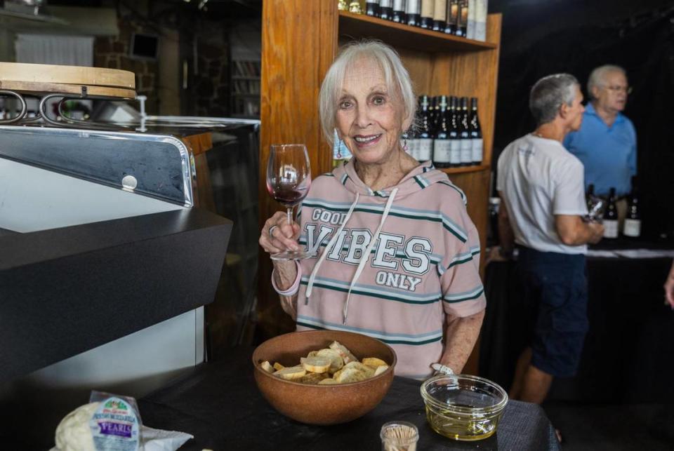 Ellen Dressler, enjoys drinking some wine, during a wine tasting, at the landmark family business Sunset Corners located at 8701 Sunset Dr., in Miami, on Saturday, June 1, 2024.