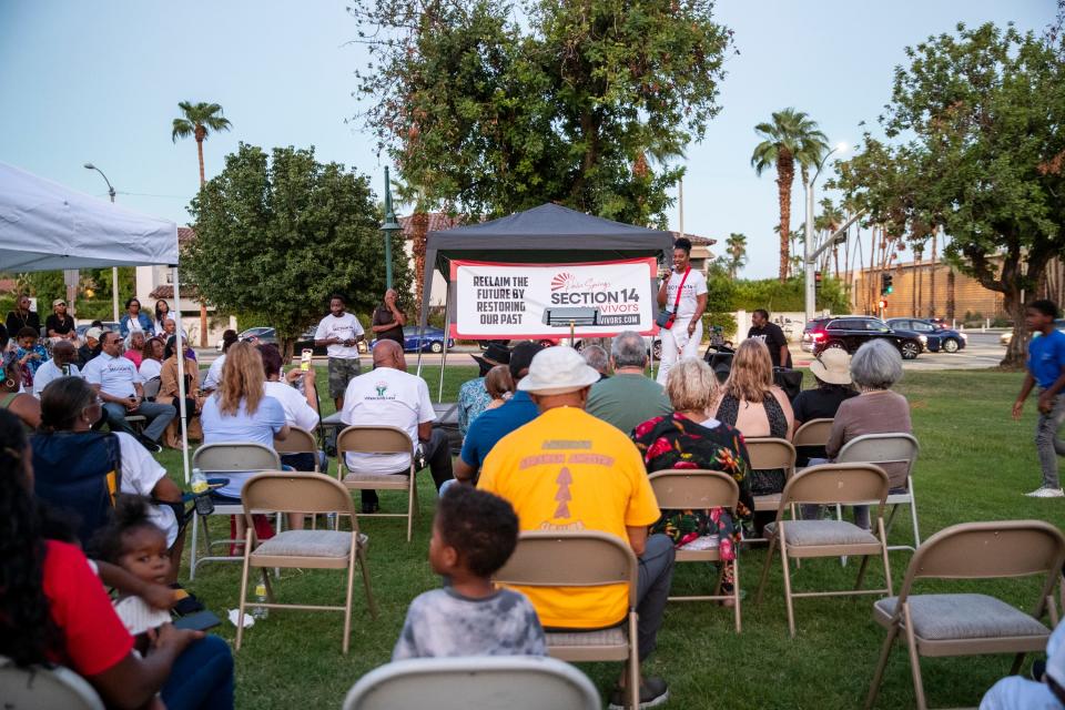 People listen during a Section 14 Survivors unity rally and prayer vigil at Frances Stevens Park in Palm Springs, Calif., on Saturday, Sept. 17, 2022. 
