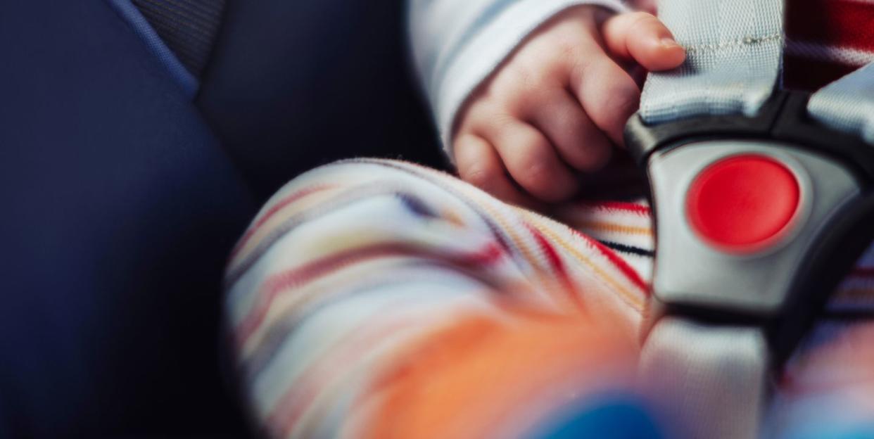 Baby in car seat.