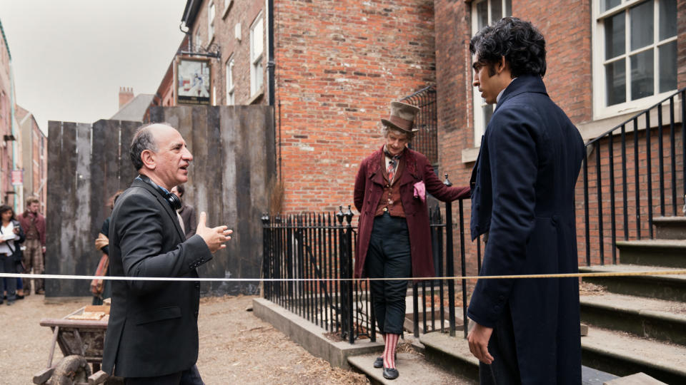 Armando Iannucci, Peter Capaldi and Dev Patel on set of 'The Personal History of David Copperfield'. (Credit: Lionsgate)