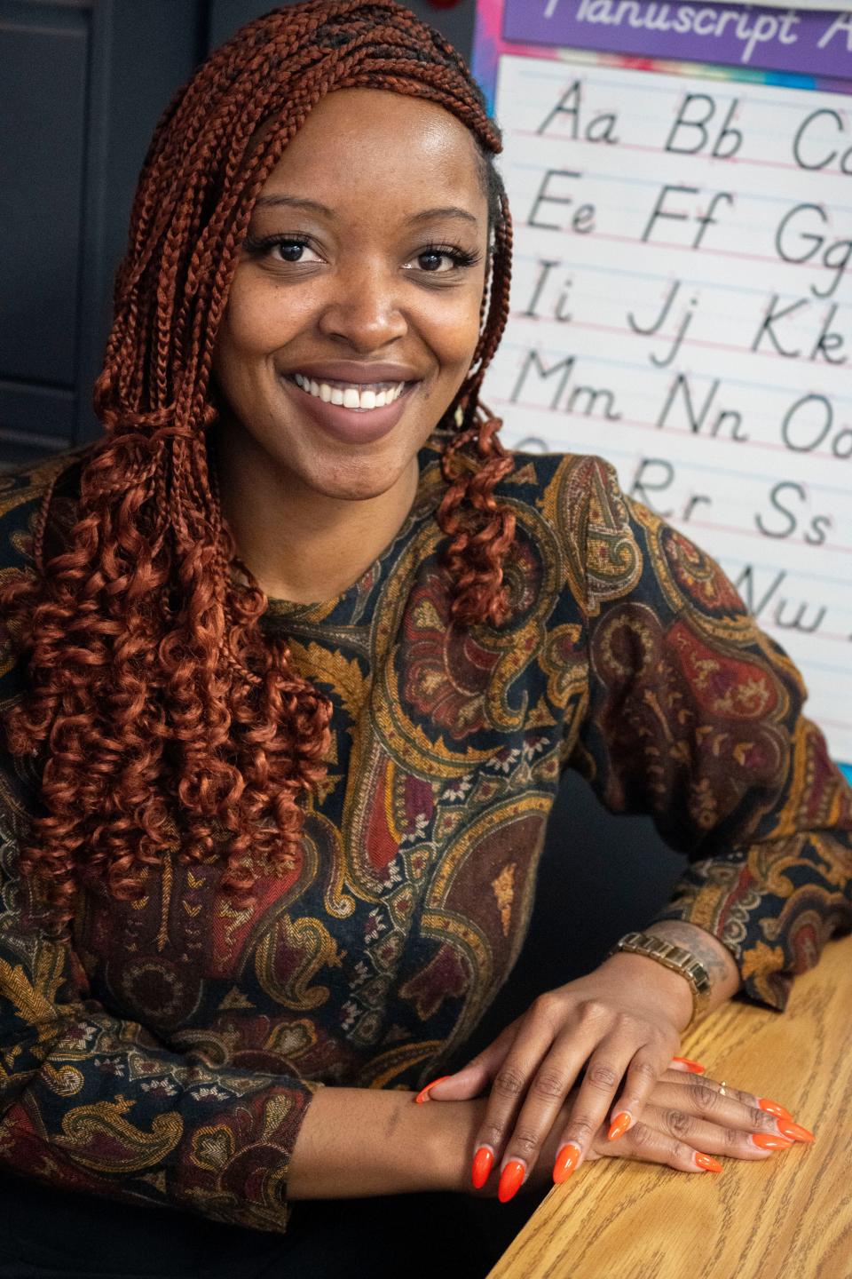 Brooke Arnett-Holman, program director of Circle City Readers, poses for a portrait Thursday, Nov. 9, 2023, at Vision Academy at Riverside in Indianapolis, the school where she started her teaching career.