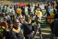 South African President Cyril Ramaphosa greets African National Congress supporters at the Siyanqoba rally at FNB stadium in Johannesburg, South Africa, Saturday, May 25, 2024. South African will vote in the 2024 general elections on May 29. (AP Photo/Jerome Delay)