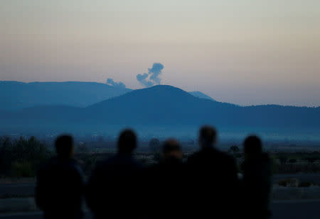 Smoke rises from the Syria's Afrin region, as it is pictured from near the Turkish town of Hassa, on the Turkish-Syrian border in Hatay province, Turkey January 20, 2018. REUTERS/Osman Orsal