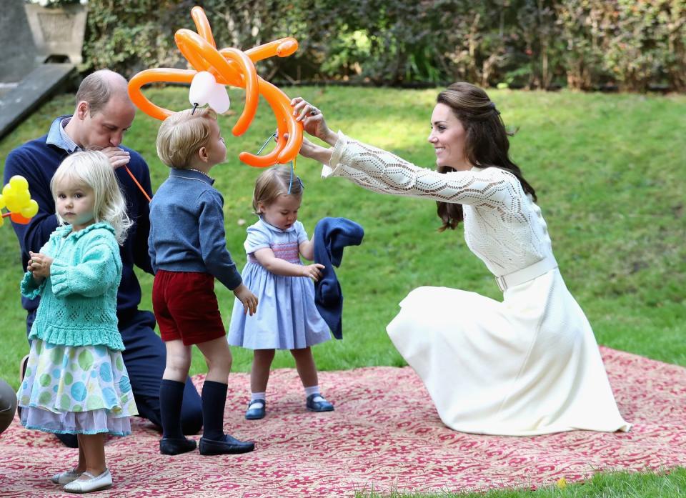 <p>Prince George and his sister Charlotte <a href="https://www.townandcountrymag.com/society/tradition/a8023/princess-charlotte-balloons/" rel="nofollow noopener" target="_blank" data-ylk="slk:loved playing with the balloons;elm:context_link;itc:0;sec:content-canvas" class="link ">loved playing with the balloons</a> at a children's party for military families in Victoria. </p>