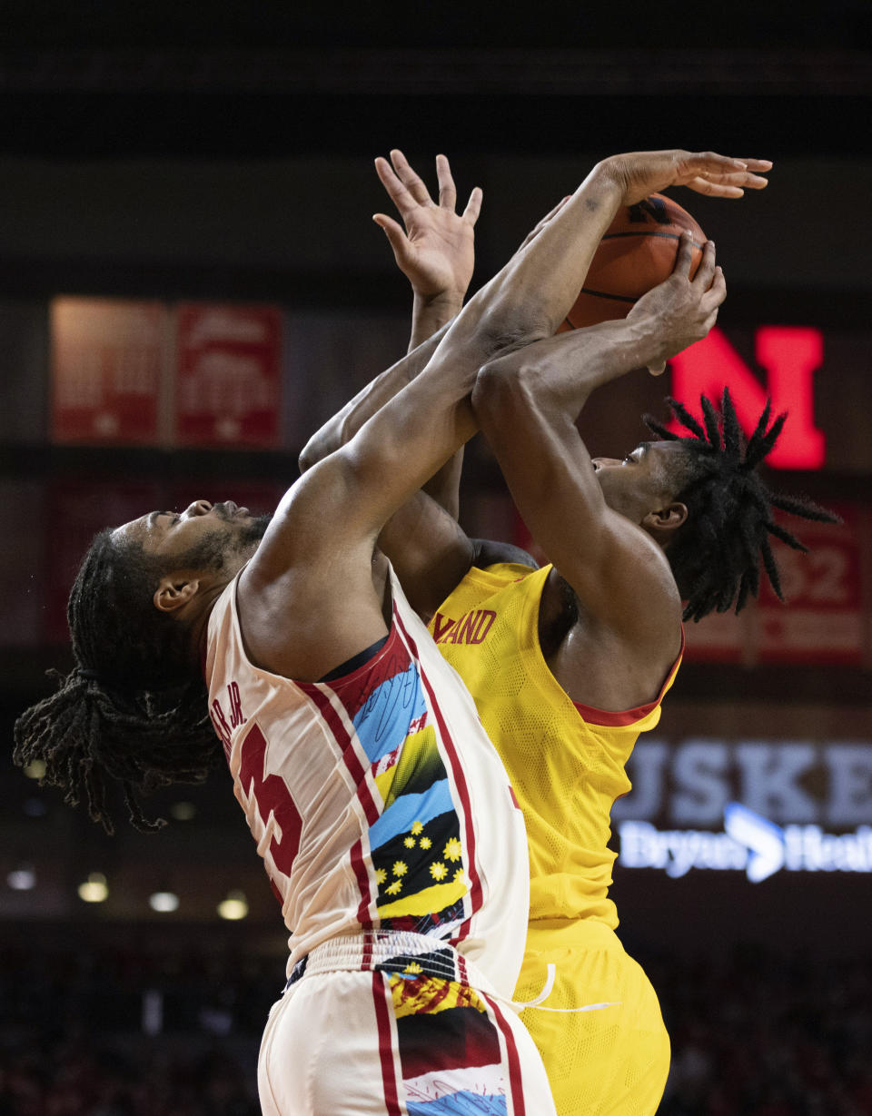 Nebraska's Derrick Walker, left, blocks a shot by Maryland's Hakim Hart during overtime of an NCAA college basketball game Sunday, Feb. 19, 2023, in Lincoln, Neb. Nebraska won 70-66. (AP Photo/Rebecca S. Gratz)