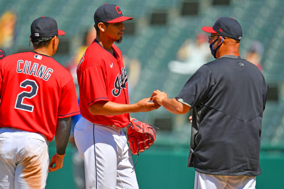 Cleveland pitcher Carlos Carrasco is removed from the game by manager Terry Francona, a common sight as starting pitchers are pulled early this season. (Photo by Jason Miller/Getty Images)