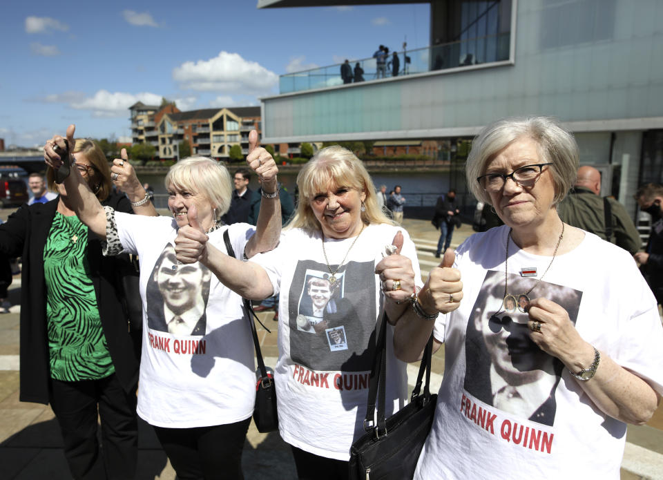 FILE - In this Tuesday May 11, 2021 file photo, family members of Frank Quinn react after the inquest in Belfast, Northern Ireland. U.K. government minister, Northern Ireland Secretary Brandon Lewis, stood before lawmakers on Thursday May 13, 2021, and formally apologized for the killing of 10 civilians during unrest in Belfast half a century ago, as Britain and Northern Ireland struggle to come to terms with the events of the past. (AP Photo/Peter Morrison, File)
