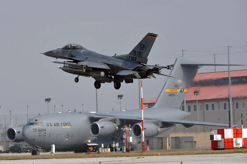 F-16 in front of a C-17 at Aviano Air Base