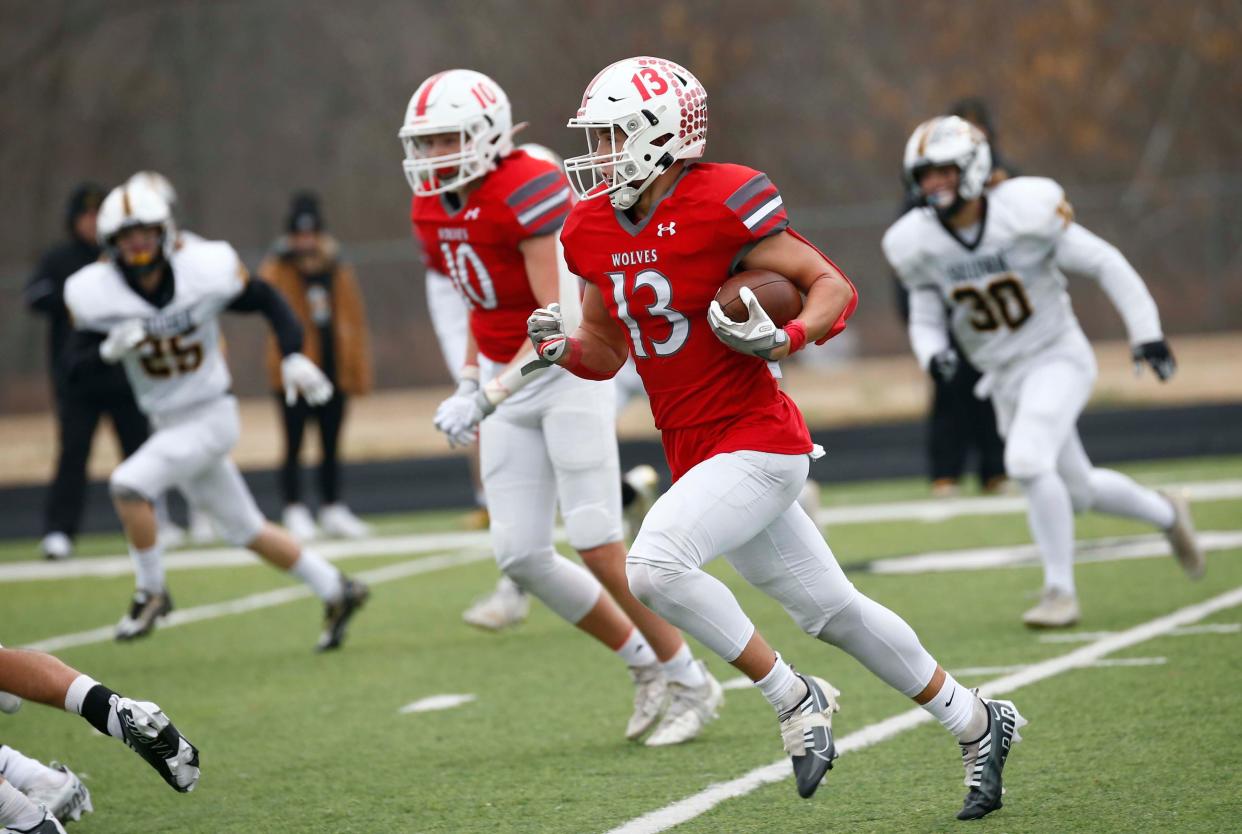 James Dowdy runs the ball during Reeds Spring's 49-20 win over Sullivan in a Class 3 state semifinal football game on Saturday, Nov. 26, 2022, in Reeds Spring, Missouri.