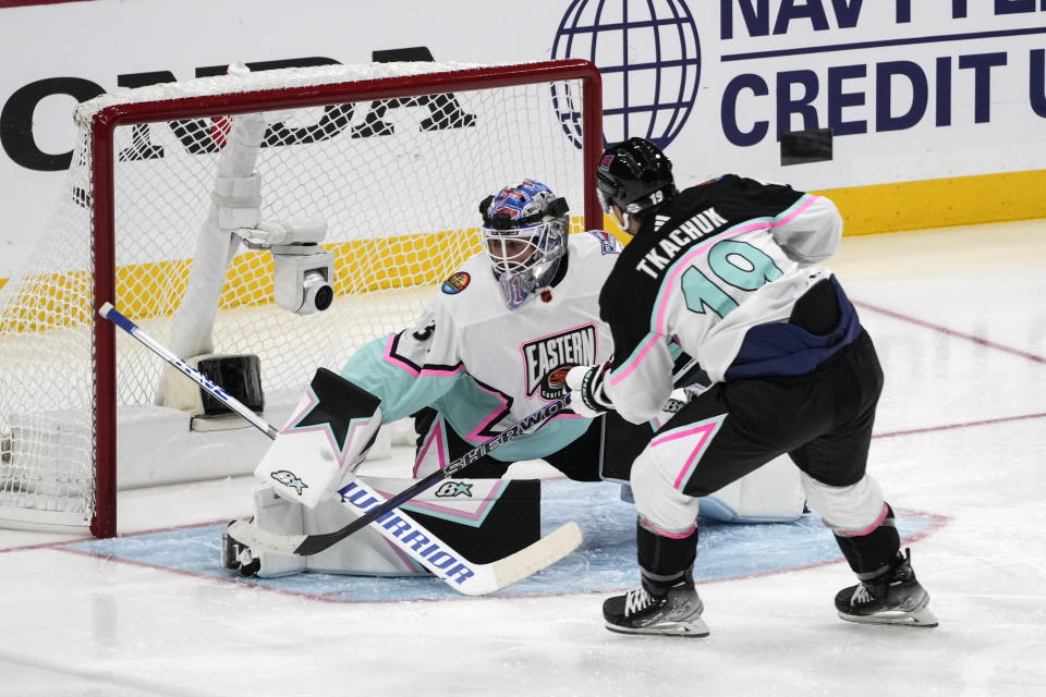 Atlantic Division's Matthew Tkachuk, of the Florida Panthers (19) scores against Metropolitan Division's goaltender Igor Shesterkin, of the New York Rangers (31) during the NHL All Star hockey game, Saturday, Feb. 4, 2023, in Sunrise, Fla. (AP Photo/Marta Lavandier)