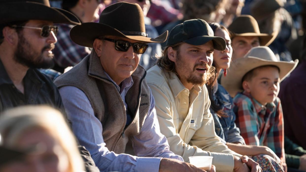  From left to right: Cole Hauser as Rip, Kevin Costner as John and Luke Grimes as Kayce watching a rode in Yellowstone. 