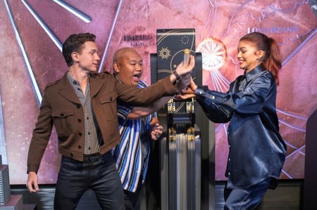 FILE PHOTO: Actors (L-R) Tom Holland, Jacob Batalon, and Zendaya take part in a ceremony to light the top of the Empire State Building to promote their new film, Spider-Man: Far From Home in New York