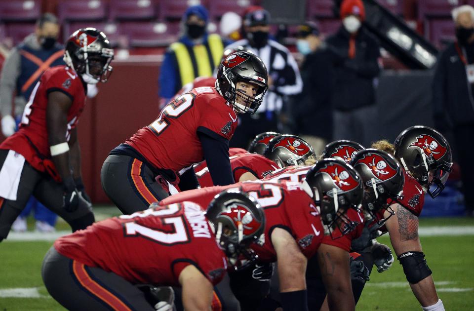 Tom Brady lines up behind the Tampa Bay Buccaneers' line during a wild card playoff win over the Washington on Jan. 9, 2021 in Landover, Maryland.