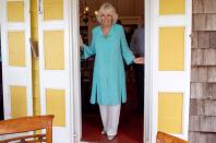 <p>While visiting St. Kitts and Nevis on a <a href="https://www.townandcountrymag.com/society/tradition/g26850147/prince-charles-camilla-parker-bowles-royal-tour-caribbean-2019-photos/" rel="nofollow noopener" target="_blank" data-ylk="slk:royal tour of the Caribbean;elm:context_link;itc:0;sec:content-canvas" class="link ">royal tour of the Caribbean</a>, Camilla wore a tiffany blue, embroidered caftan with white pants, turquoise drop earrings, and gold ballet flats. </p>