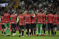 AC Milan's players wear a Zlatan Ibrahimovic's jersey after his last game for the club at the end of a Serie A soccer match between AC Milan and Hellas Verona at the San Siro stadium, in Milan, Italy, Sunday, June 4, 2023. (AP Photo/Antonio Calanni)