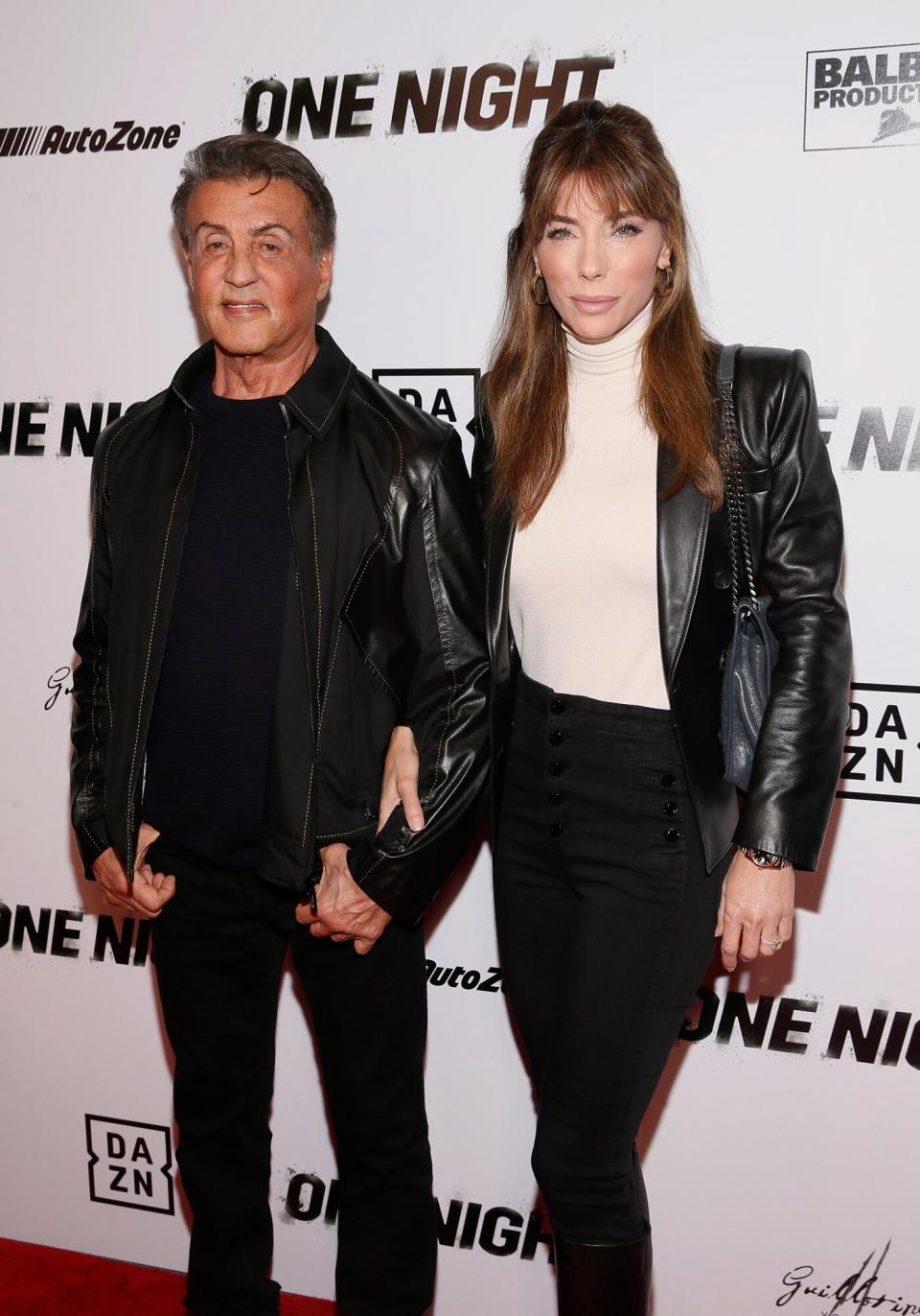 Sylvester Stallone, Jennifer Flavin. Executive Producer Sylvester Stallone, left, and wife and entrepreneur Jennifer Flavin, right, pose on the red carpet at the premiere of DAZN's "ONE NIGHT: JOSHUA VS. RUIZ," a documentary film from Balboa Productions and DAZN Originals at the Writers Guild Theater, in Beverly Hills, Calif DAZN's "ONE NIGHT: JOSHUA VS. RUIZ" Premiere, Beverly Hills, USA - 21 Nov 2019