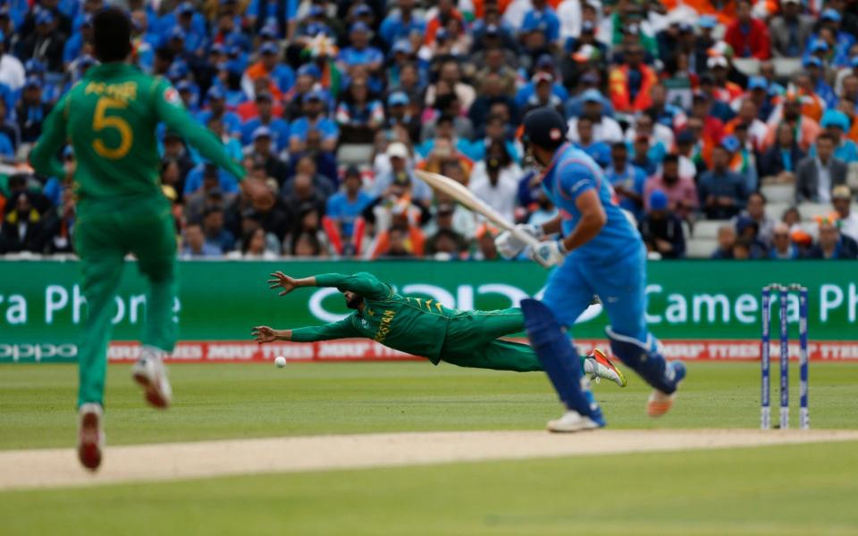 Azhar Ali dives for a catch - Credit: Reuters