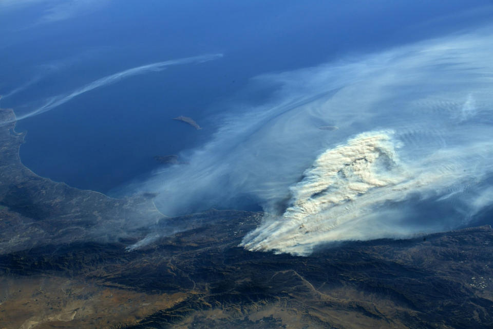 <p>A photo taken from the International Space Station and moved on social media by astronaut Randy Bresnik shows smoke rising from wildfire burning in Southern California, Dec. 5, 2017. (Photo: @AstroKomrade/NASA/Handout via Reuters) </p>