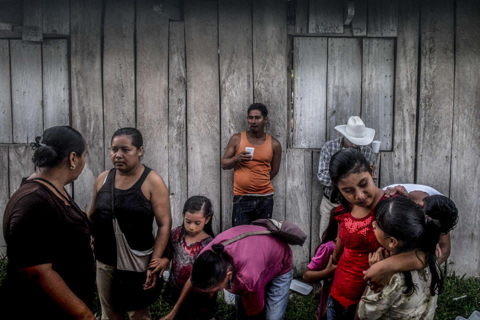 <p>Members of the small community of Guadalupe Carney, near the city of Tocoa, Bajo Aguán region, Honduras. Another sector that has suffered a disproportionate number of attacks are peasants groups engaged in land conflicts with large agro-business enterprises â for instance, in the Bajo Aguán, where more than 100 campesino land rights activists have been killed during a drawn-out conflict with the Dinant Corporation. (Photo: Francesca Volpi) </p>