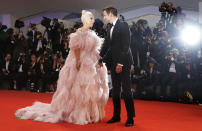 File - Actors Lady Gaga, left, and Bradley Cooper pose for photographers upon arrival at the premiere of the film 'A Star Is Born' at the Venice Film Festival. The 77th Venice Film Festival will kick off on Wednesday, Sept. 2, 2020, but this year's edition will be unlike any others. Coronavirus restrictions will mean fewer Hollywood stars, no crowds interacting with actors and other virus safeguards will be deployed. (AP Photo/Kirsty Wigglesworth, File)