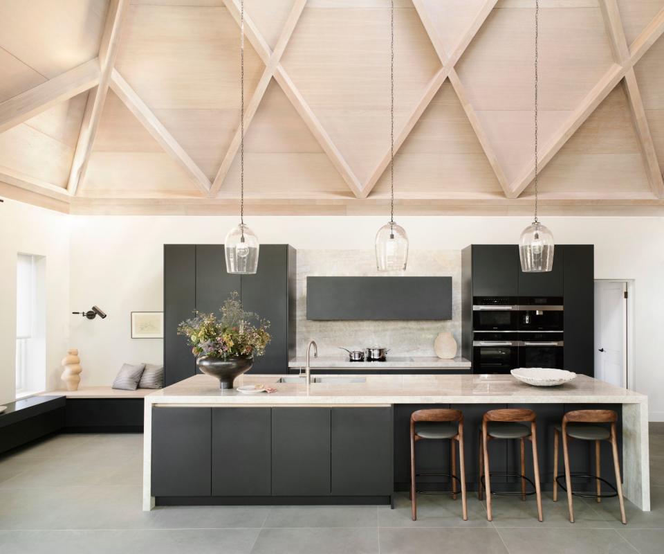 Kitchen island, wooden seats, hanging lights