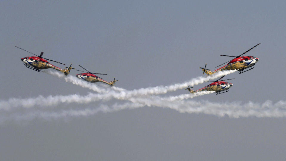 The Sarang Helicopters perform a display during rehearsals ahead of Air Force Day at the air force station in Hindon near New Delhi, India, Tuesday, Oct. 6, 2015. The Indian Air Force (IAF) was established on Oct. 8, 1932. (Shirish Shete/Press Trust of India via AP) INDIA OUT