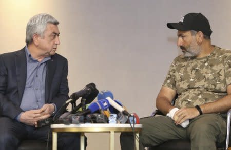 Armenian Prime Minister Serzh Sarksyan (L) meets with opposition MP Nikol Pashinyan in Yerevan, Armenia April 22, 2018. REUTERS/Vahram Baghdasaryan/Photolure