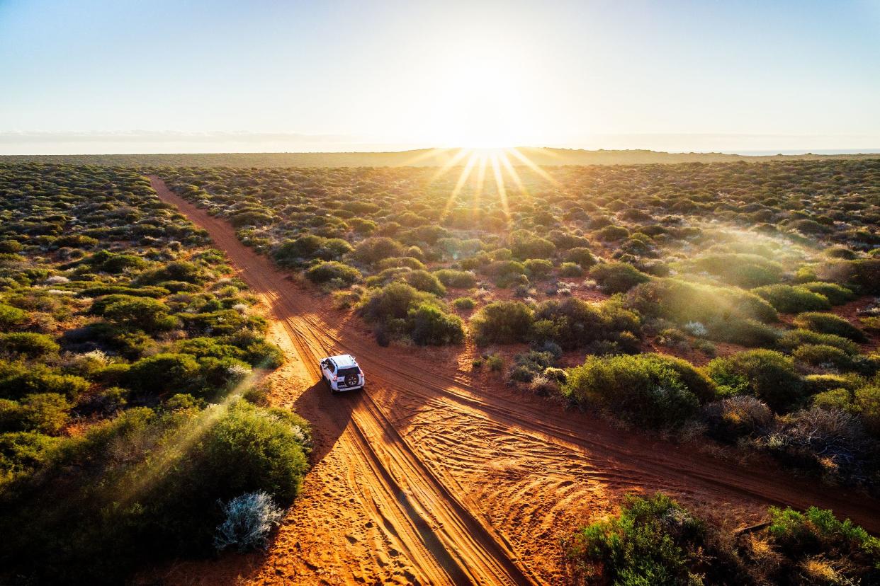 Off-road driving in Western Australia at sunset, aerial view.François Perron National Park