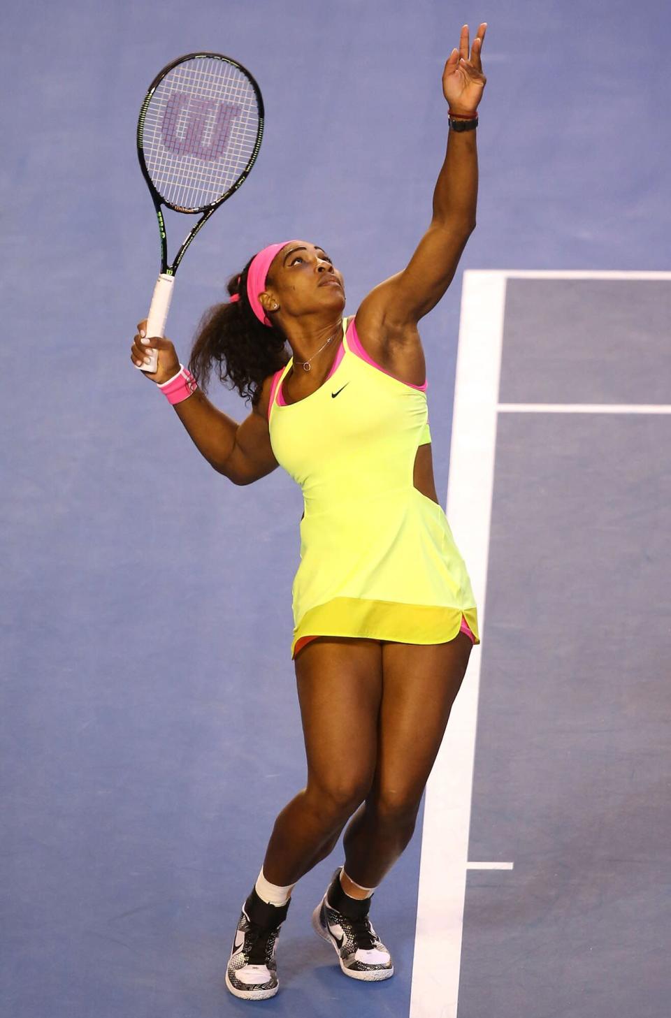 Serena Williams of the United States serves in her women's final match against Maria Sharapova of Russia during day 13 of the 2015 Australian Open at Melbourne Park on January 31, 2015 in Melbourne, Australia