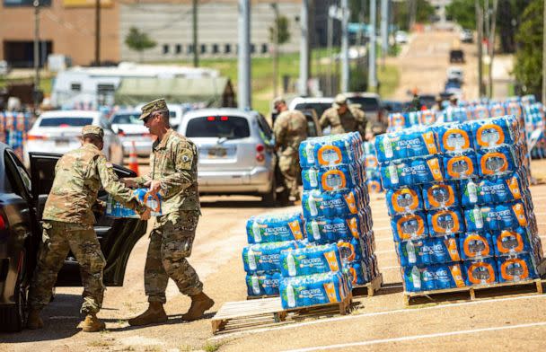 PHOTO: Soldiers of the Mississippi Army National Guard help distribute water at the Mississippi State Fairgrounds in Jackson, Miss., Sept. 1, 2022.<p>Jackson Water Crisis (Liam Kennedy/Clarion Ledger via USA Today Network )