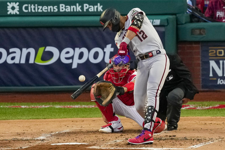 Arizona Diamondbacks' Lourdes Gurriel Jr. hits a home run off Philadelphia Phillies starting pitcher Aaron Nola during the second inning in Game 6 of the baseball NL Championship Series in Philadelphia Monday, Oct. 23, 2023.(AP Photo/Matt Rourke)