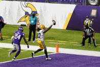 Green Bay Packers wide receiver Davante Adams (17) catches a 1-yard touchdown pass ahead of Minnesota Vikings defensive back Holton Hill (24) during the second half of an NFL football game, Sunday, Sept. 13, 2020, in Minneapolis. (AP Photo/Jim Mone)