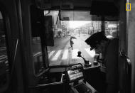 <p>Photograph and caption by Hiro Kurashina/National Geographic Travel Photographer of the Year Contest. — “This is a view of the main street from a tram in Nagasaki on a rainy day. The tram is vintage, but retrofitted with modern ticketing equipment. A conductor is no longer on board <span>— </span>only the lone driver. The quiet streetscape seen through the front windshield of the tram somehow caught my attention. This view presents quite a contrast to busy urban centers in Japan, such as Tokyo and Osaka. The ride on a vintage tram through the relatively quiet main street was a memorable experience during our weeklong visit to the historic city of Nagasaki.” Nagasaki, Japan. </p>