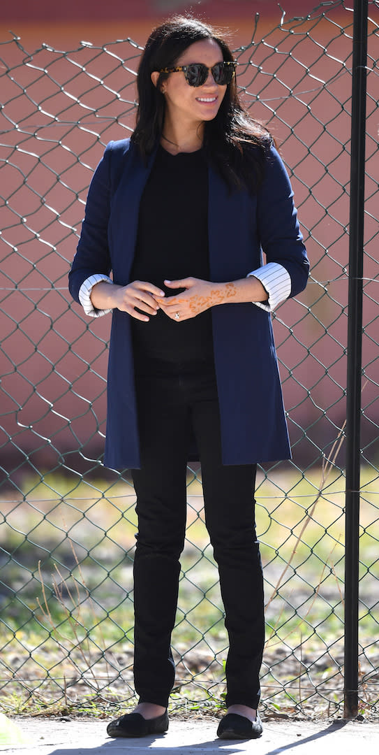 For a day of engagements in the Atlas Mountains, Meghan donned a navy Alice + Olivia blazer with black Hatch skinny jeans and a matching cashmere sweater by Misha Nonoo. She ditched her signature heels for her Birdies slippers [Photo: PA]