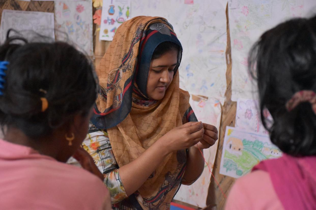 Rohingya women and girls are taught sewing, play games, receive medical care and are offered counselling at women-only centres run by charities like IRC in Cox's Bazar: Jessica Wanless