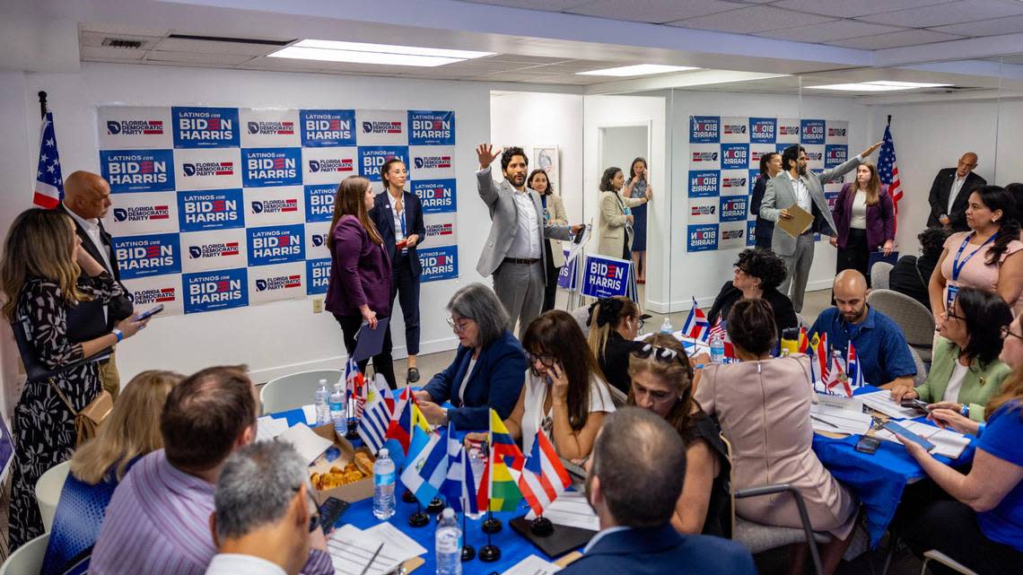 President of the Miami-Dade Democratic Caucus Juan Cuba, center, speaks to volunteers for the Biden/Harris campaign at the opening of the Miami-Dade Democratic Hispanic Caucus Office in Coral Gables, Florida, on Wednesday, March 27, 2024. The visit also highlighted the launch of the campaign’s Latino outreach program in Florida.