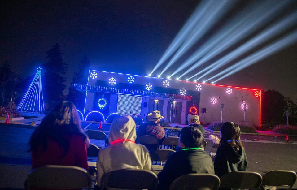 Lincoln Presbyterian Church holds it's 3rd annual Christmas light show in it's parking lot in Stockton on Friday, Dec. 9, 2022.  The church first held the show as a drive-thru event 2020 during the COVID-19 pandemic. "We wanted to do something special" said Pastor Jon Hathorn. "It's a gift from our church fo the community." About 15,000 lights adorn 2 buildings at the church and are synced with a 21-minute musical presentation shown on a loop several times. The church held the show as a walk-up event on Dec. 9 and 10, with refreshments, hay rides, games and crafts for children. On Friday, Dec. 16 and the following 9 days, the church will hold the show as a drive-thru event. 