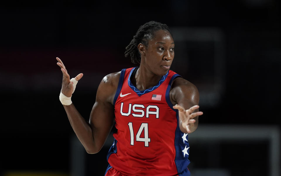 United States' Tina Charles (14) celebrates after three point basket during women's basketball preliminary round game against France at the 2020 Summer Olympics, Monday, Aug. 2, 2021, in Saitama, Japan. (AP Photo/Charlie Neibergall)