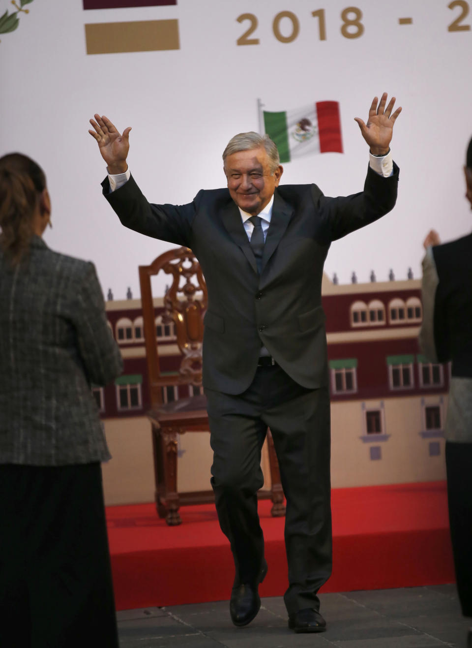 Mexican President Andres Manuel Lopez Obrador walks toward first lady Beatriz Gutierrez at the end of a ceremony to mark his second anniversary in office, at the National Palace in Mexico City, on Tuesday, December 1, 2020. (Photo AP/Marco Ugarte)