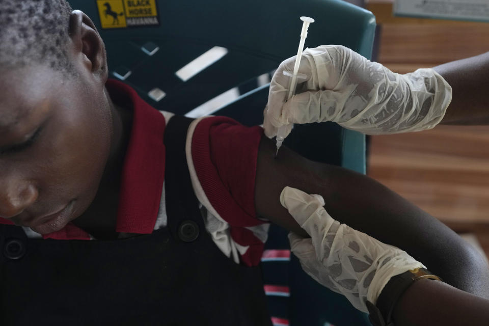 A health worker administers a cervical cancer vaccine HPV Gardasil to a girl on the street in Ibadan, Nigeria, on May 27, 2024. African countries have some of the world's highest rates of cervical cancer. Growing efforts to vaccinate more young girls for the human papillomavirus are challenged by the kind of vaccine hesitancy seen for some other diseases. Misinformation can include mistaken rumors that girls won't be able to have children in the future. Some religious communities must be told that the vaccine is "not ungodly." More than half of Africa's 54 nations – 28 – have introduced the vaccine in their immunization programs, but only five have reached the 90% coverage that the continent hopes to achieve by 2030. (AP Photo/Sunday Alamba)