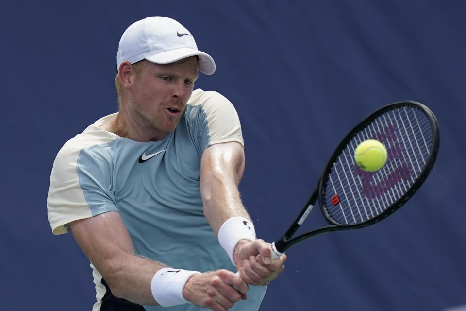 Kyle Edmund, of Britain, returns during a first round match against Yosuke Watanuki, of Japan, at the Citi Open tennis tournament in Washington, Monday, Aug. 1, 2022. (AP Photo/Carolyn Kaster)