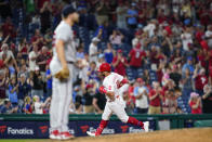 Philadelphia Phillies' Kyle Schwarber, right, rounds the bases after hitting a home run against Atlanta Braves pitcher Dylan Lee during the seventh inning of a baseball game, Tuesday, June 28, 2022, in Philadelphia. (AP Photo/Matt Slocum)