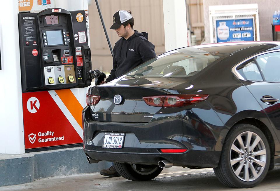 Jaret Mareno returns the nozzle and hose after filling his gas tank at $4.32 a gallon at the Circle K on Claremont Avenue on Thursday, May 12, 2022. TOM E. PUSKAR/TIMES-GAZETTE.COM