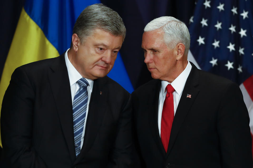 United States Vice President Mike Pence, right, talks with Ukrainian President Petro Poroshenko, left, during a bilateral meeting at the Munich Security Conference in Munich, Germany, Saturday, Feb. 16, 2019. (AP Photo/Matthias Schrader)