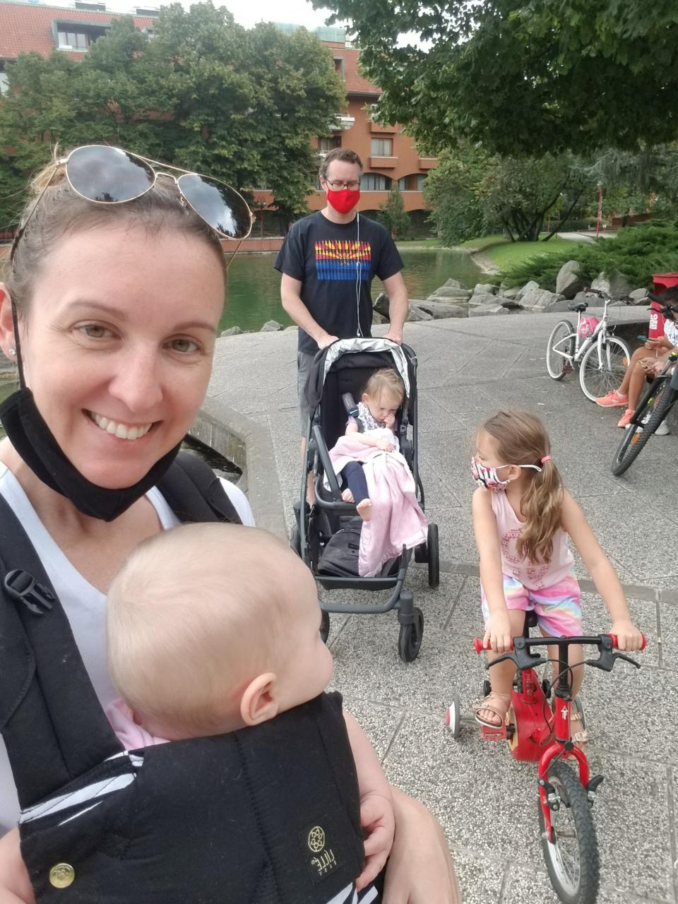 Ahwatukee parents Kendra and Dave Riley take a stroll at their hotel with their three daughters, Eva, Olivia and Keira. The Rileys flew to Milan seeking gene therapy for Keira, who like Olivia was diagnosed with MLD.