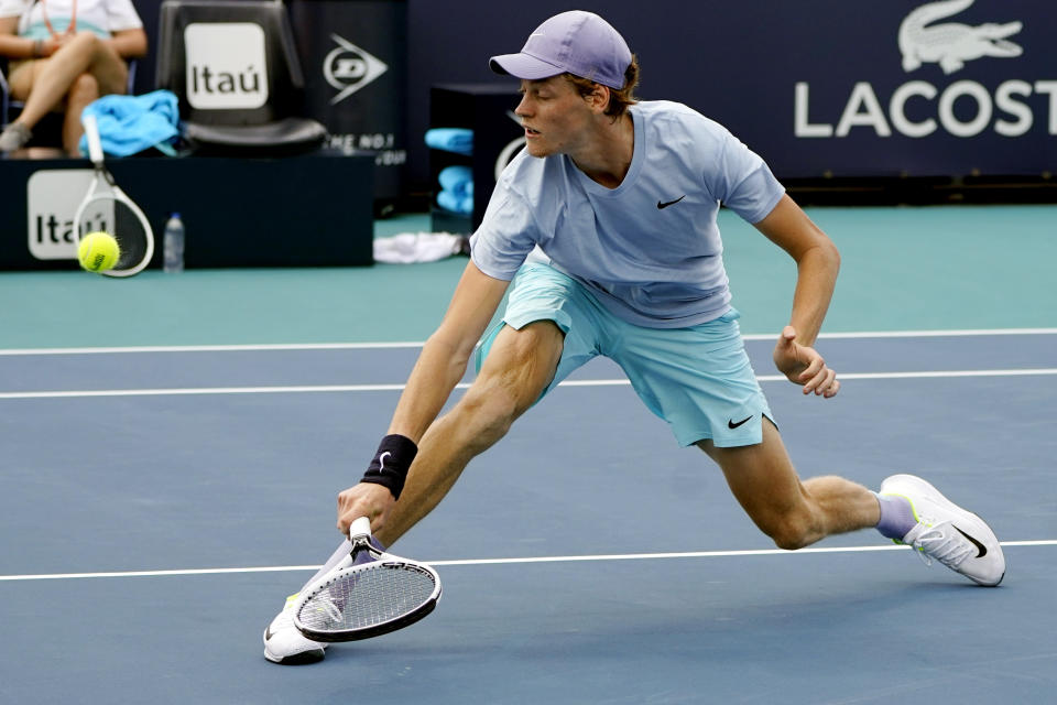 Jannik Sinner, of Italy, returns to Roberto Bautista Agut, of Spain, during the semifinals of the Miami Open tennis tournament, Friday, April 2, 2021, in Miami Gardens, Fla. (AP Photo/Lynne Sladky)