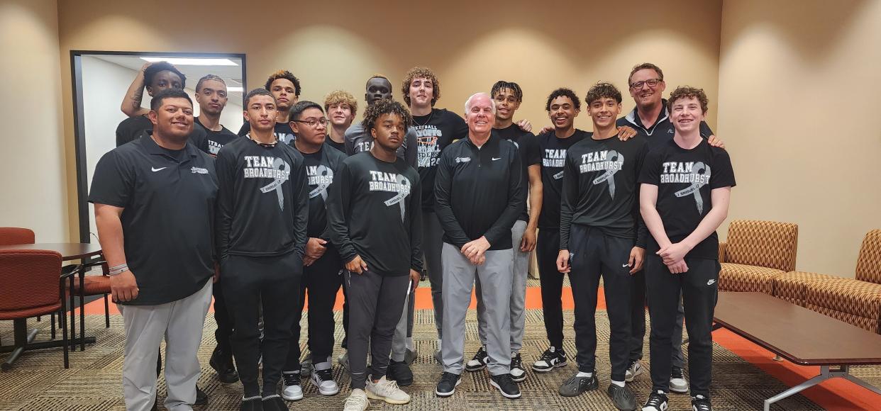 Randall High School basketball coach Leslie Broadhurst, center, stands with his players and assistant coaches at a Canyon ISD Board Meeting in Canyon in this April file photo.