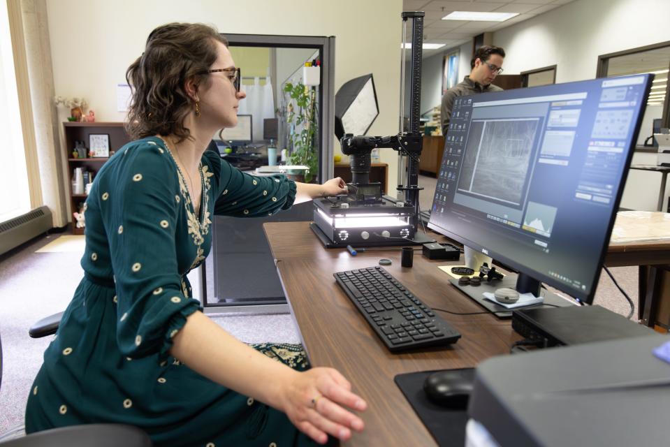 Nikki Pegarsch, digitization assistant at UW-La Crosse's Murphy Library, digitizes materials related to the Mississippi River and the Driftless region.